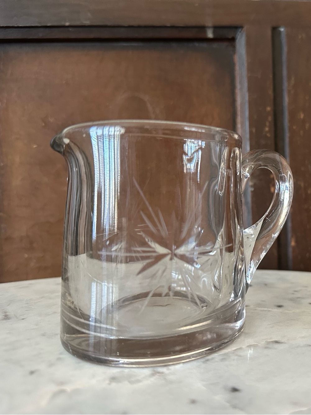 Vintage MCM clear glass starburst creamer pitcher, round with handle
